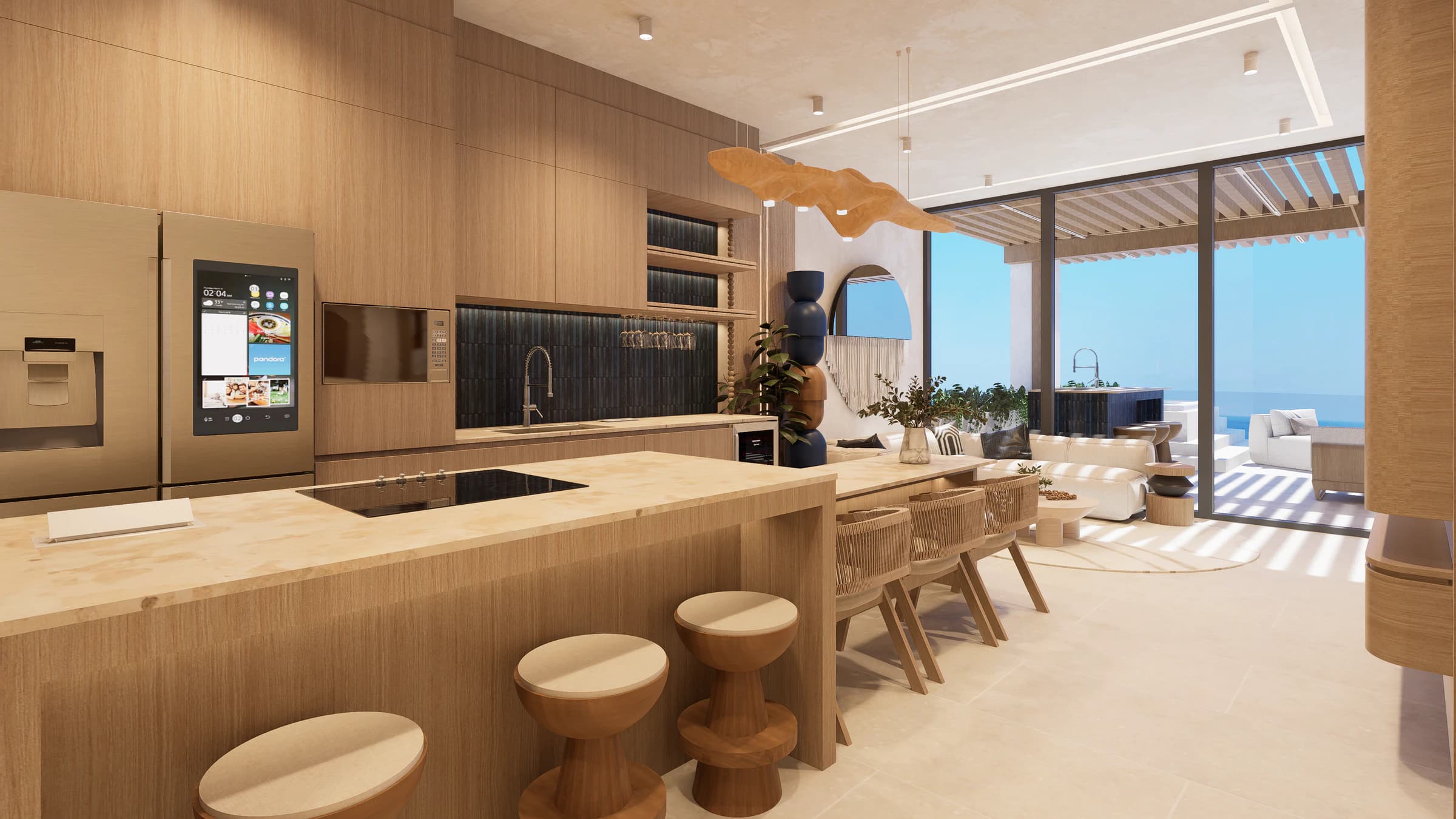 Kitchen and living area in three-bedroom residence configuration 607 with the ocean visible beyond the terrace