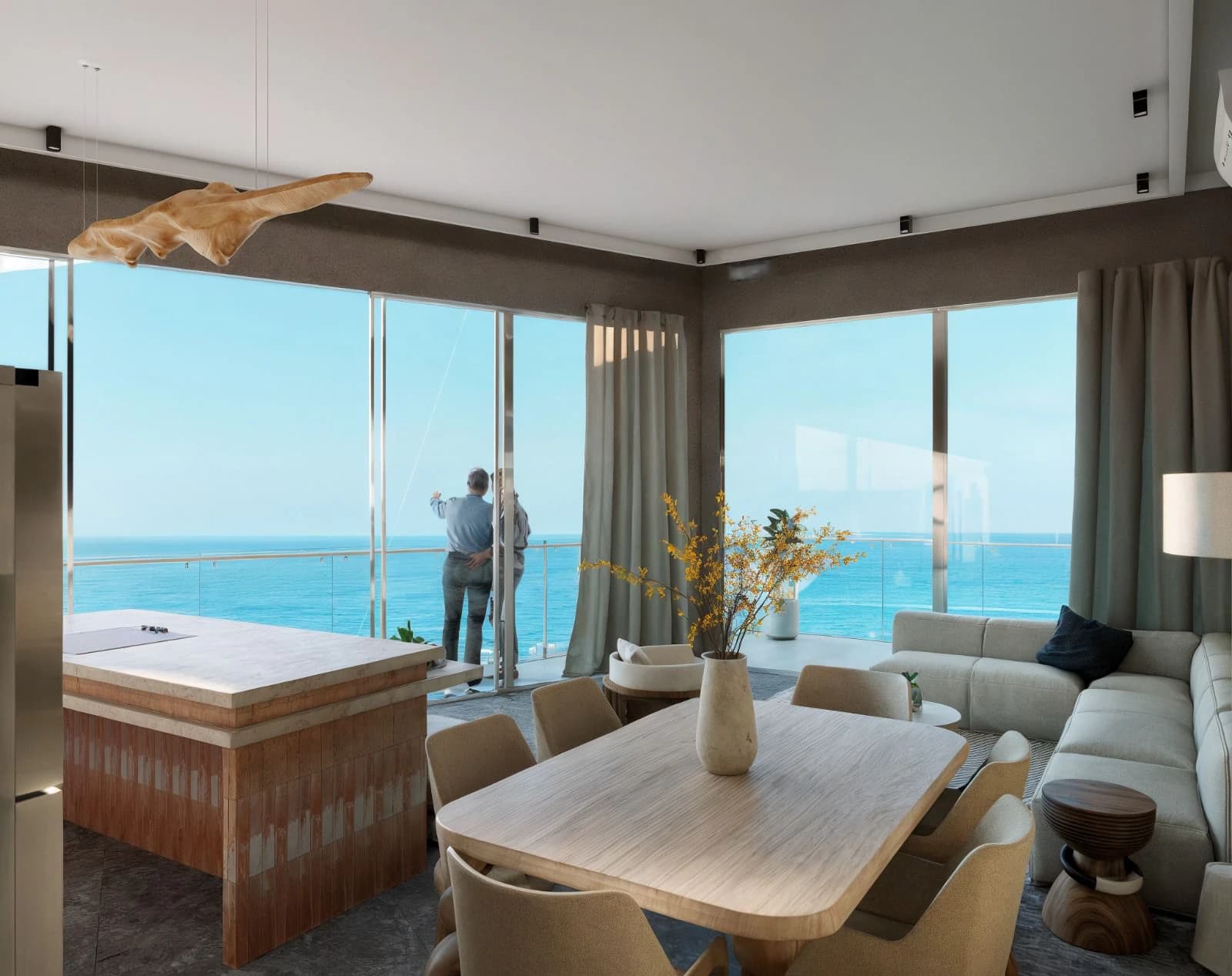 Two-bedroom living and dining area opening toward the ocean