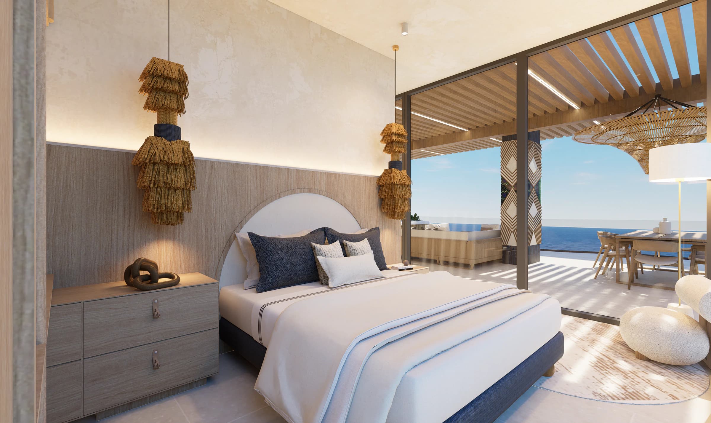 Nayari bedroom opening to a furnished terrace with the Pacific beyond