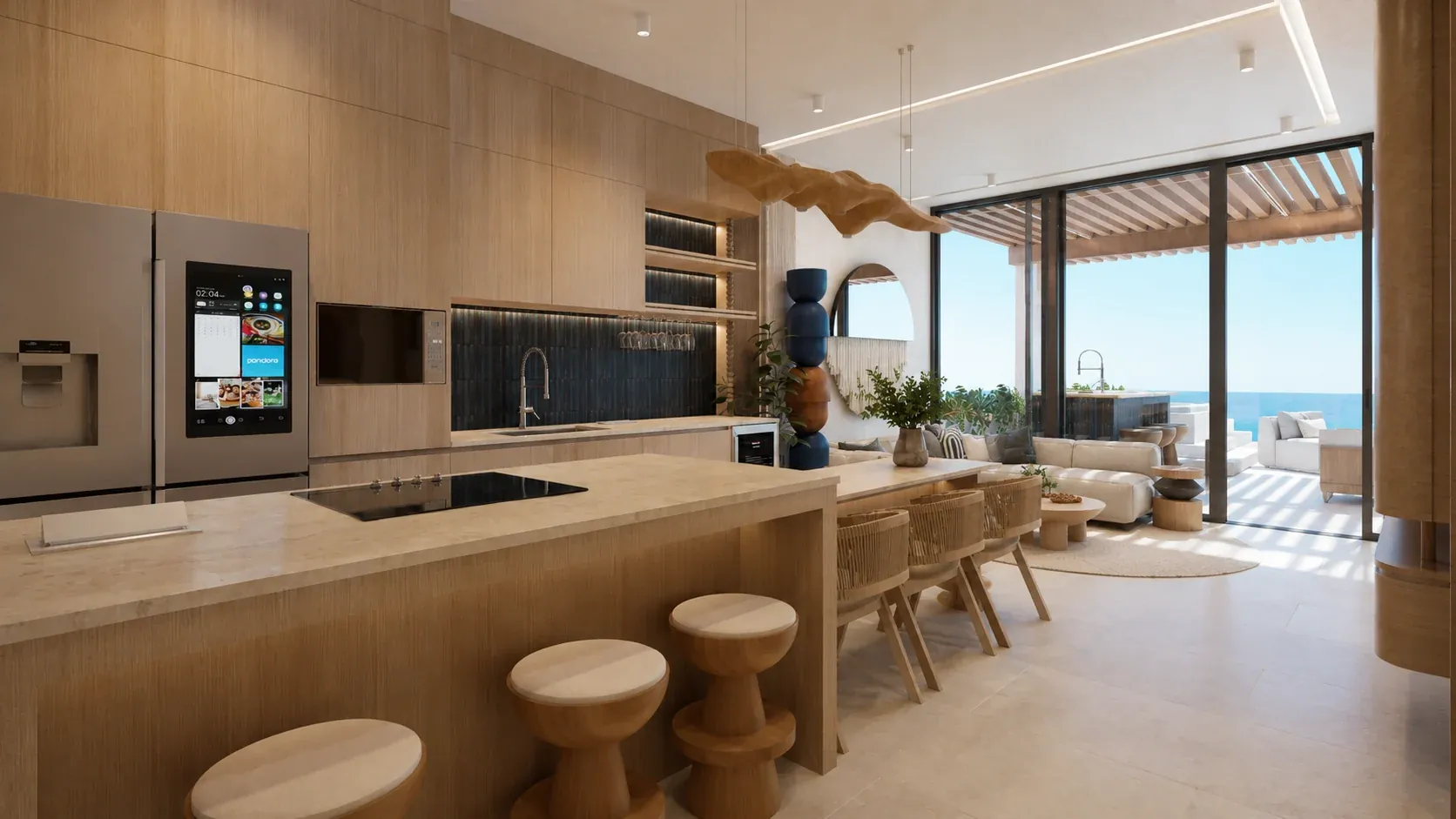 Kitchen and living area in three-bedroom residence configuration 607 with the ocean visible beyond the terrace