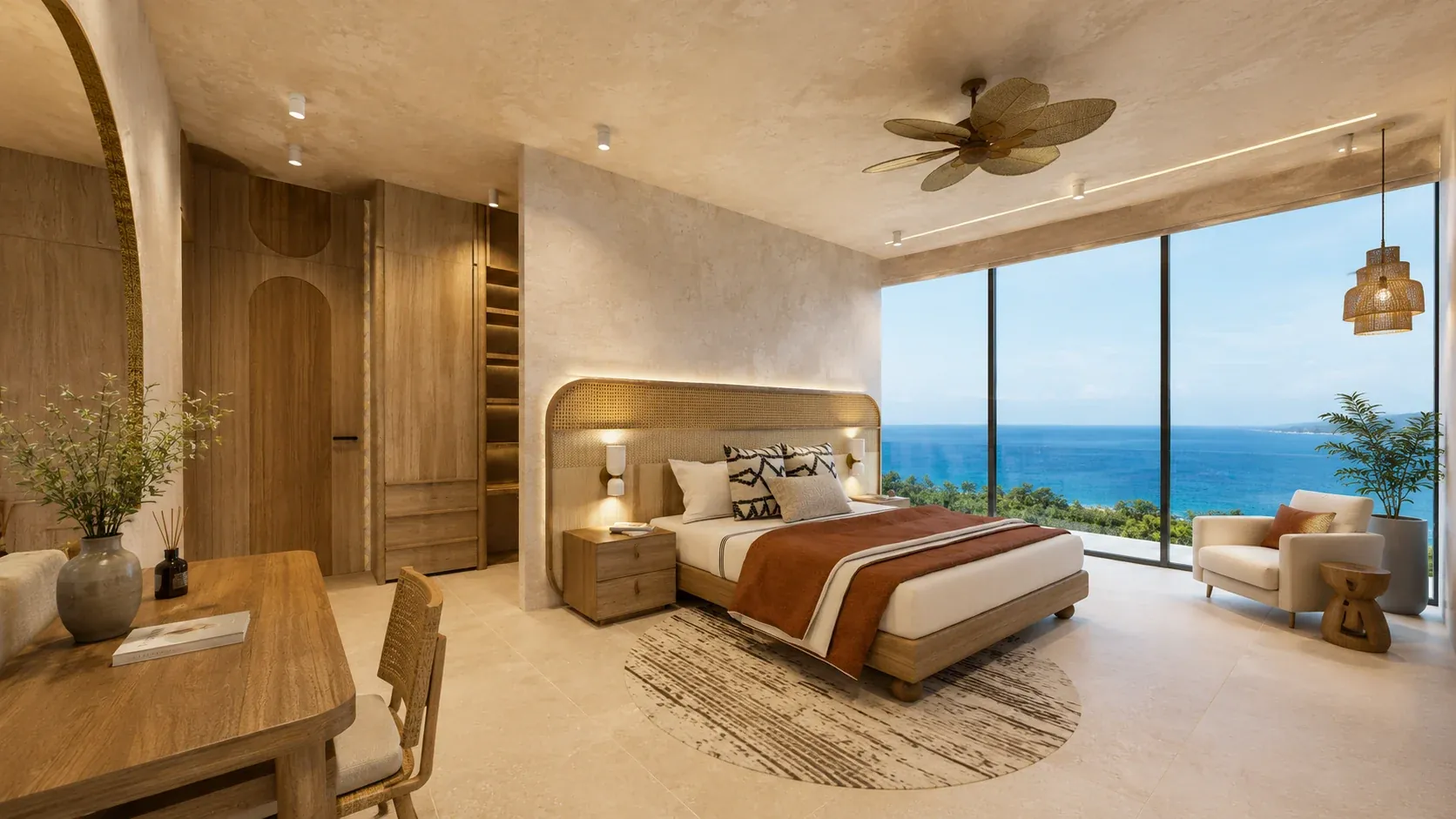 Primary bedroom in a two-bedroom residence with the ocean visible through full-height glass